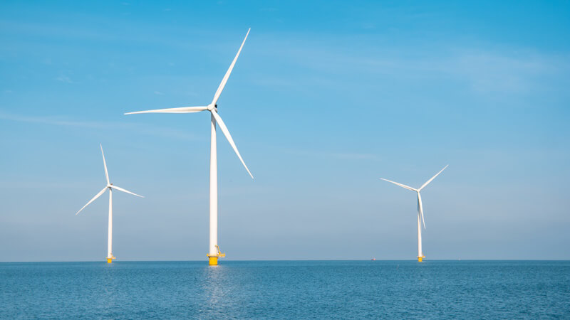 Three offshore wind turbines in an array